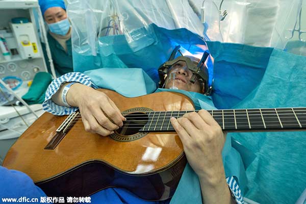 Musician receives brain surgery while playing guitar